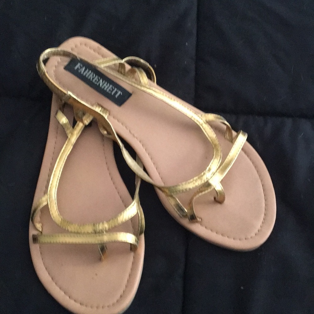 Gold Fahrenheit sandals.